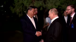 Putin and Xi embrace to seal strategic partnership