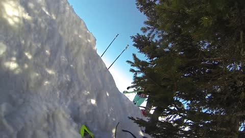 Gopro guy on green skiis crashes while going downhill