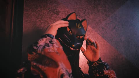 Urban trendy woman wearing a cat mask