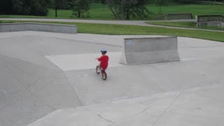 Boy riding bike at skate park