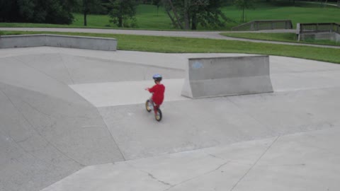 Boy riding bike at skate park