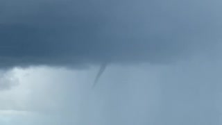 Funnel Forms Above Farmer's Crops