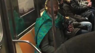 Man on subway train says if he gets locked up give him some milk and cheese