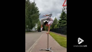 Kid acrobat has unbelievable balance