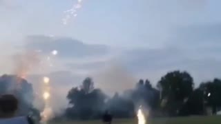 Multiple fireworks going off one kid falls as firework goes off on floor