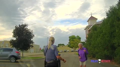 Police Sergeant Joins Woman Dancing Alone in Street