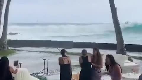 A big wave put that damper on a wedding reception in Hawaii