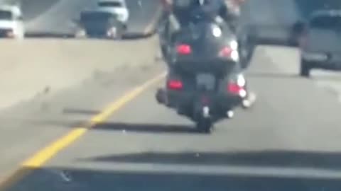 Motorcyclist Jamming Out on the Highway