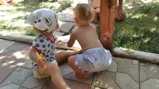 Children decide who will play with an interesting piece of paper