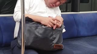 Sleeping Salaryman on train