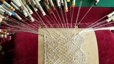 Craftswoman Shows The Intricate Process Of Lace Making