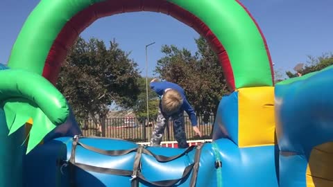 Slo-mo front flip fail-jumping castle