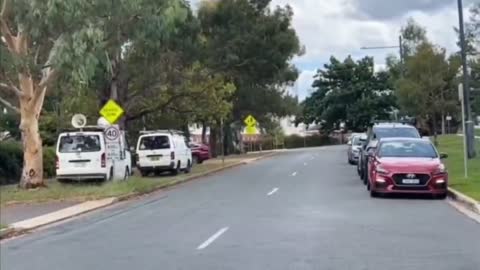 Australian Prime Minister Scott Morrison runs away from Australian protesters.