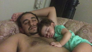 Baby falls asleep on daddy