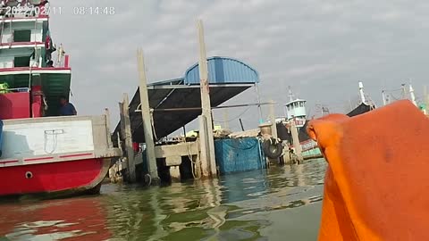 Todd chats with the fishermen and rescues a life jacket