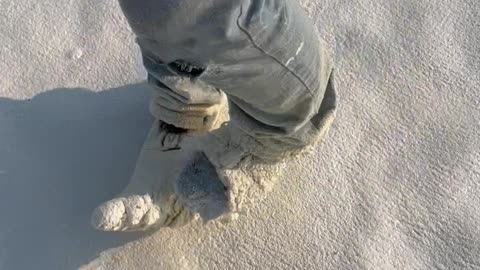 Roofer Breaking Foam Overspray off Work Shoes