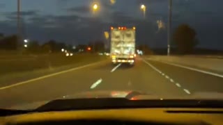 A Car and a Semi Dance on the Highway