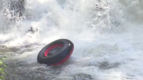 Guy loses inner tube, crashes over waterfall