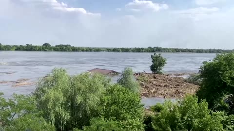 Moment roof washes away in Ukraine dam breach