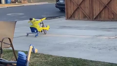 Kid Vibin' in Banana Suit Riding Tricycle