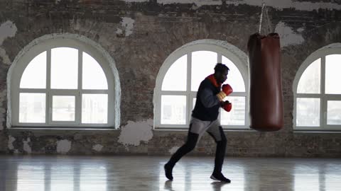 Male Boxer Training At Boxing Studio In Gloves