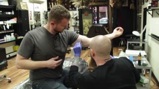 Getting a tattoo at Reinkarnated Tattoo in Dublin, Ireland