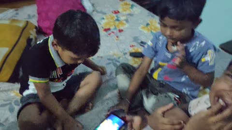 Kids play lodu game in India