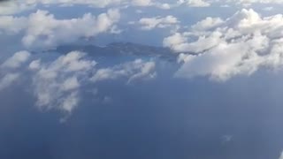 Checking out carribean Islands from the clouds