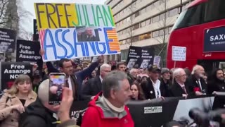 JUST IN: Julian Assange's supporters march to UK Prime Minister's office