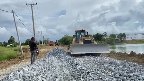 New bulldozer spreading gravel processing features building road foundation-15
