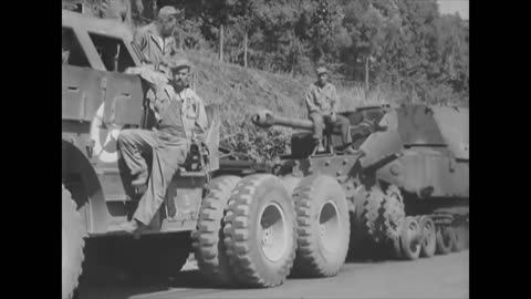 Ward LaFrance M1A1 and M26 towing a knocked out Elefant tank destroyer near Rome in June 1944