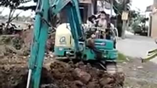 5 & 6 year old boy driving digger/excavator on his own