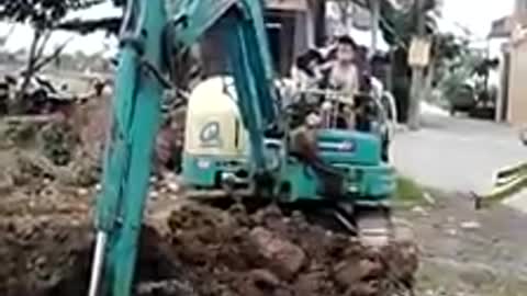 5 & 6 year old boy driving digger/excavator on his own