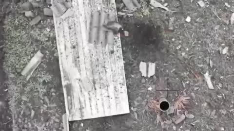 A Russian drone sneaks a grenade into what appears to be some type of chimney