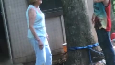 Alcoholic confronts landlady while his hair is on fire.