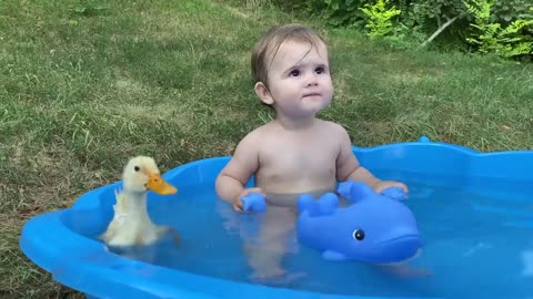 Funny baby reaction to duckling in the #pool , cute moment of baby ☺