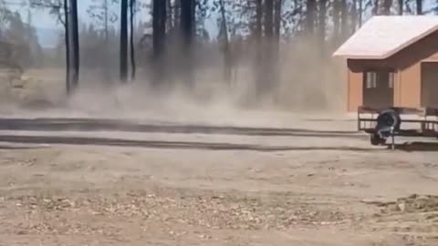 Large Dust Devil Swirls Around House at Job Site