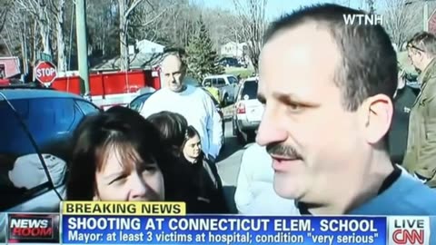 "Parents smiling and waiting in line to be interviewed at Sandy Hooks school shooting." - 2012