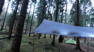 GoPro. Lanshan 2 and DD hammocks 3x3 Tarp set up in the woods.