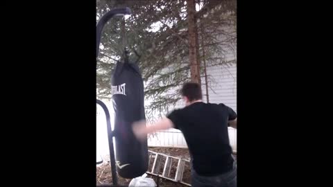 Hitting the Everlast 100 lb Heavy Bag with 16oz gloves