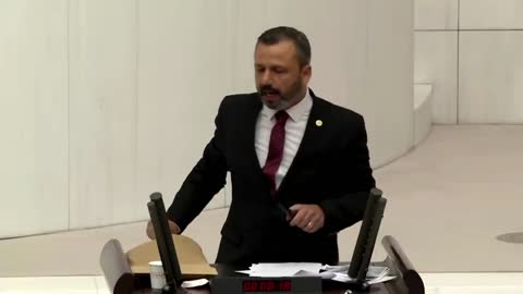 Turkish lawmaker smashes phone with hammer in parliament to protest social media bill