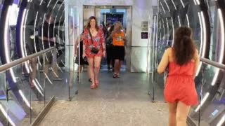 walking through the glass tunnel into the disco at Planet Hollywood Cancun