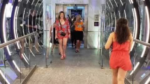 walking through the glass tunnel into the disco at Planet Hollywood Cancun