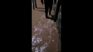 Gushing water floods streets in Spain's Laredo