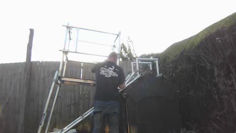 putting up a light weight chimney stack scaffold