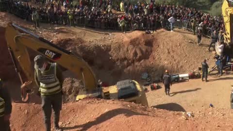 Moroccan rescuers race against the clock to dig and save the young boy trapped in a deep well