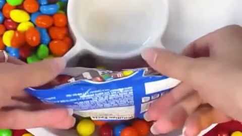 Distribute the jelly beans into the candy tray