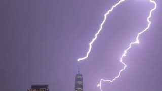 Massive bolt of lightning strikes One World Trade in sudden storm tonight in NY April 1, 2023