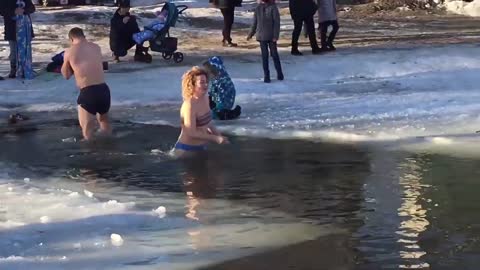 Young lady bathing Ice swimming