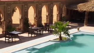 Morocco, a swimming pool near the Sahara Desert
